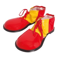 Rote und gelbe Plastikclownschuhe